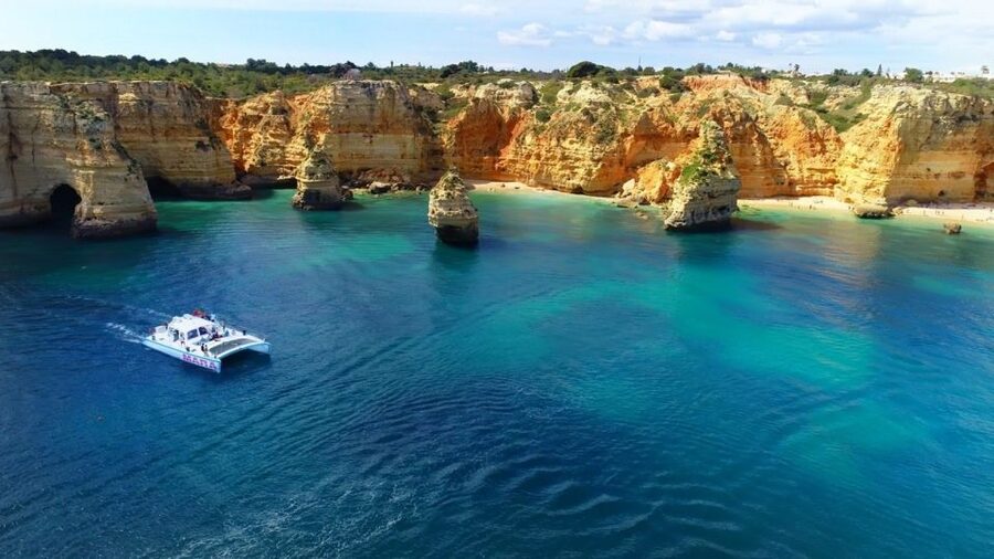 Albufeira: Catamaran Cruise with BBQ & Open Bar on the Beach - The Catamaran Cruise: Benagil, Galé, and Carvoeiro From the Sea