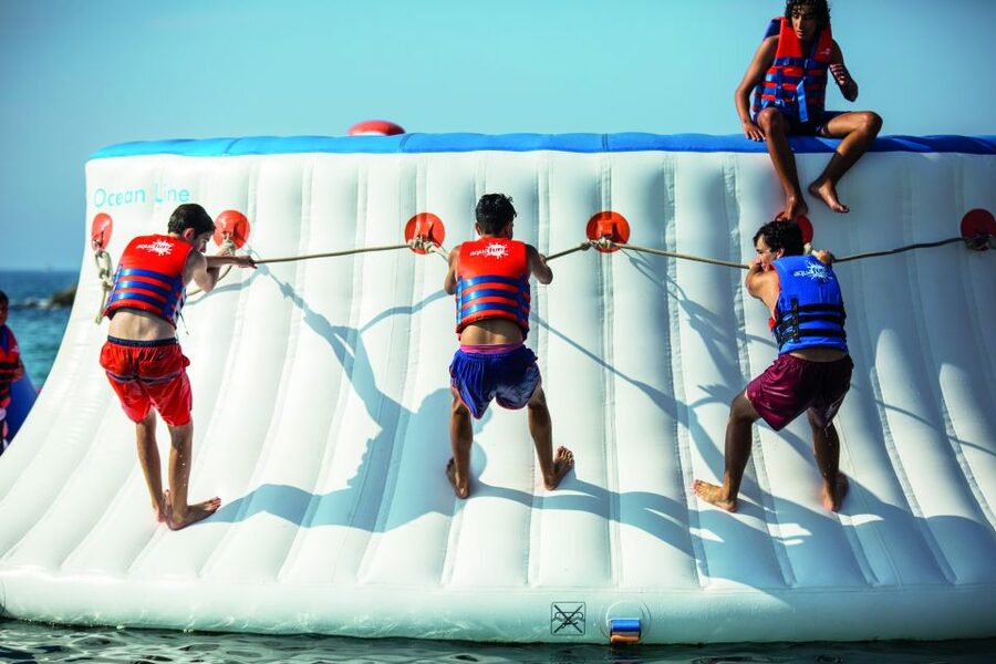 Armação de Pêra: Inflatable Waterpark Entry Ticket - Entering the scene at Praia de Armação de Pêra