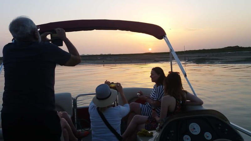 Faro: Sunset 1 hour Ria Formosa Boat Tour - How the sunset moment lands: colors in water and sky