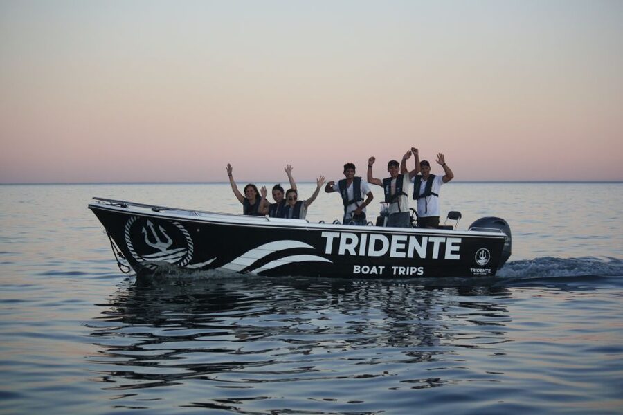From Armação de Pêra: Sunset Benagil Caves Boat Tour - On board experience: comfortable boat, life-jacket, and a guide with timing