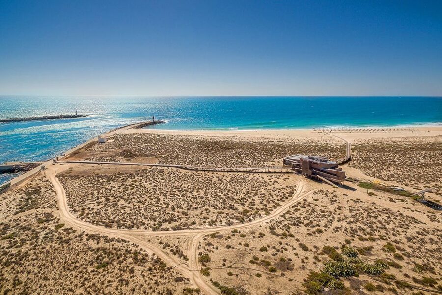 From Faro: Ria Formosa Hop-On Hop-Off 3 Islands Cruise - Farol Island: sea wall strolls, lighthouse views, and beach bars