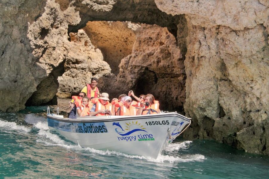 From Lagos: 2.5-Hour Guided Coastal Boat Tour & Grotto Visit - Caves in the smaller boat: what to expect and how to enjoy it