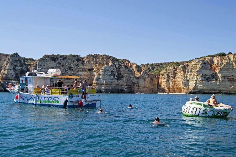 From Lagos: 2.5-Hour Guided Coastal Boat Tour & Grotto Visit - Swim, aqua trampoline, and that onboard comfort checklist