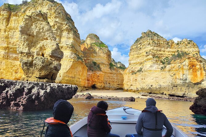 Private Boat Tour: Ponta da Piedade Grottos and Caves in Lagos - Praia do Camilo: wooden stairs, panoramic cliffs, and shell-filled rock
