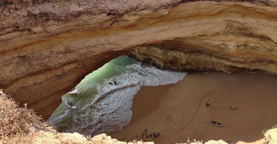 Quarteira: Benagil Cave Guided Catamaran Day Cruise & Drink - Vilamoura catamaran cruising: how the coast feels up close